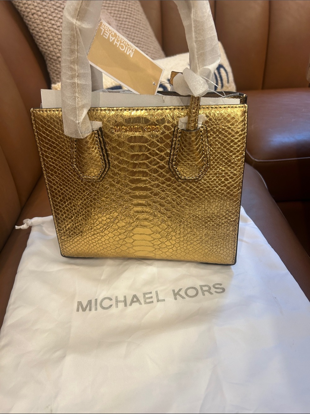 New with tags 
Michael Kors Metallic Gold Textured Small Mercer